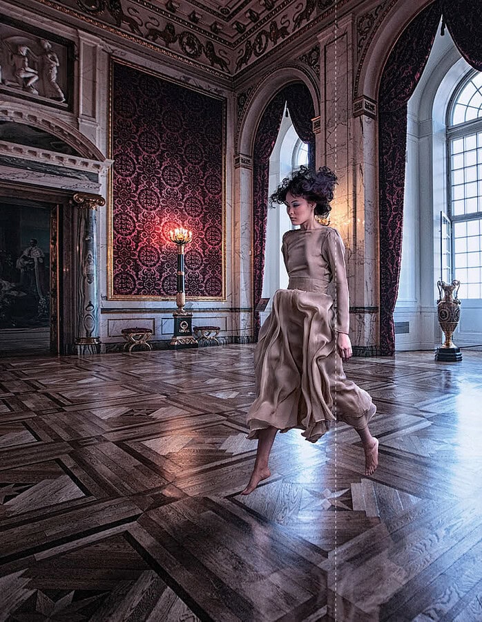 Elegant woman dancing in grand historic ballroom with ornate decor and large windows. photographer NYC