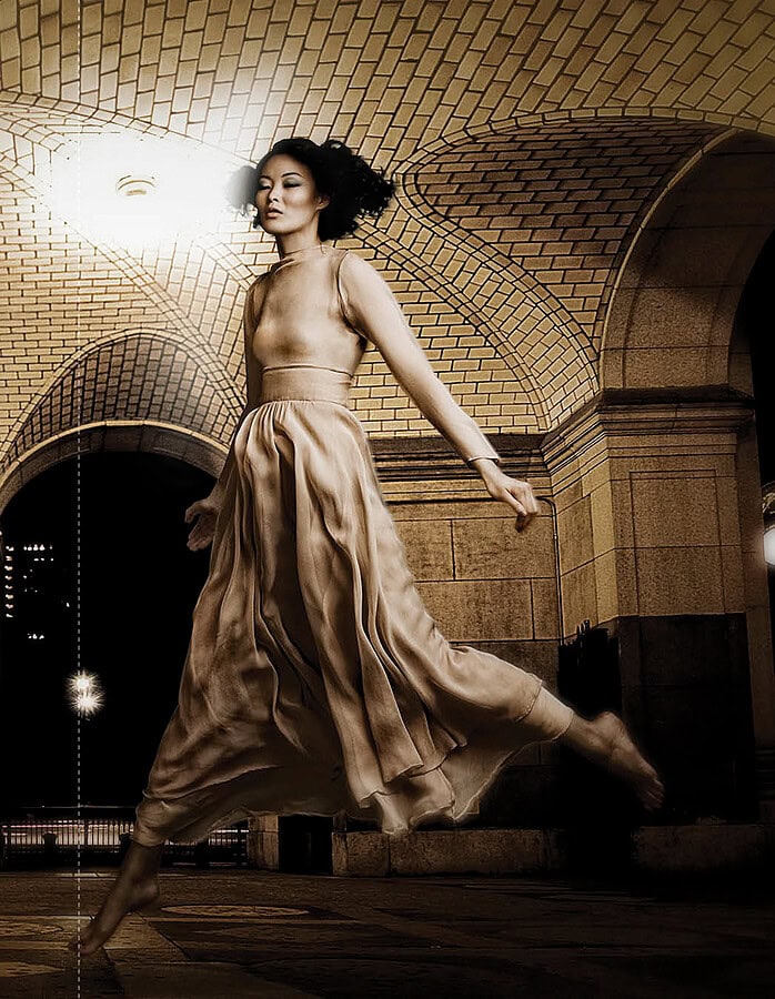 Elegant dancer performing under historic subway arch in NYC at night. photographer NYC
