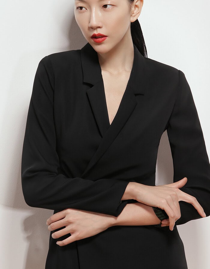 Elegant Asian woman in black blazer with sleek hair and red lipstick. photographer NYC