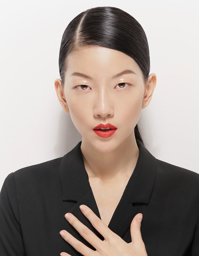 Elegant Asian woman with sleek black hair and red lipstick in a black blazer. photographer NYC