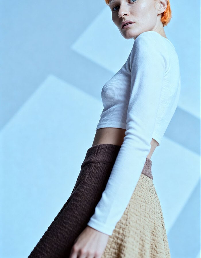 Fashion portrait of a young woman with short orange hair in stylish outfit. photographer NYC