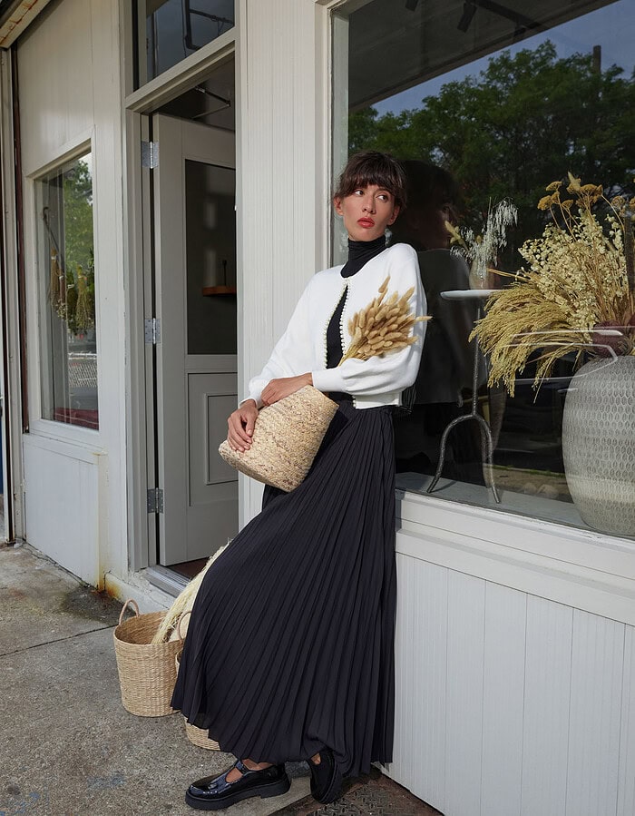 Fashionable woman in black and white outfit outside a boutique store. photographer NYC