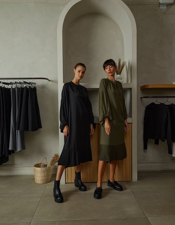 Fashionable women in stylish dresses inside a boutique store. photographer NYC