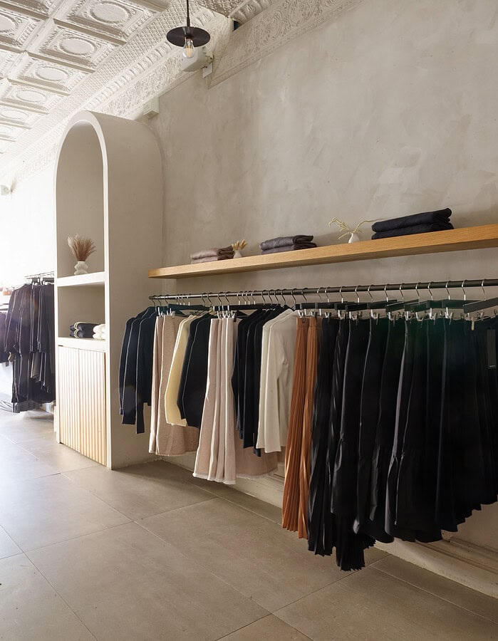 Fashion clothing display with skirts and pants on a rack in a boutique. photographer NYC