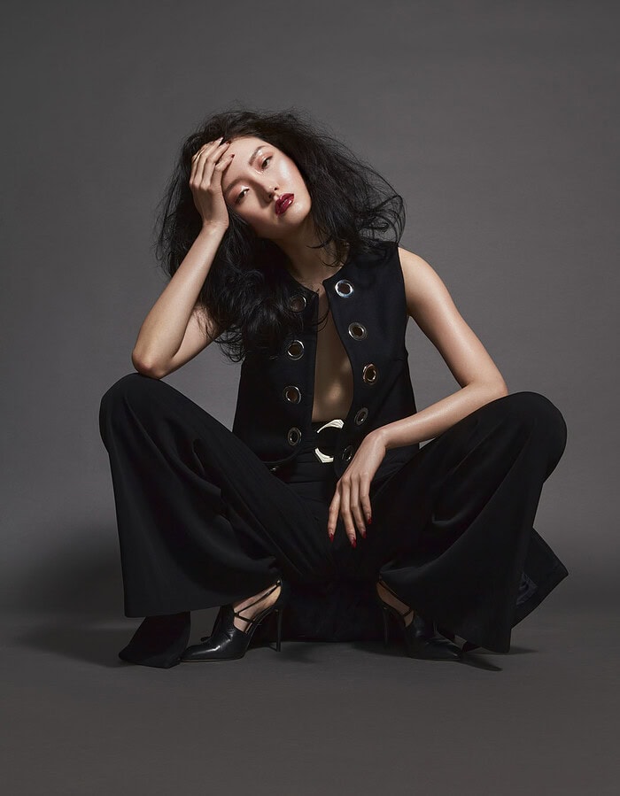 Fashion portrait of a woman in black outfit with bold makeup and wavy hair. photographer NYC