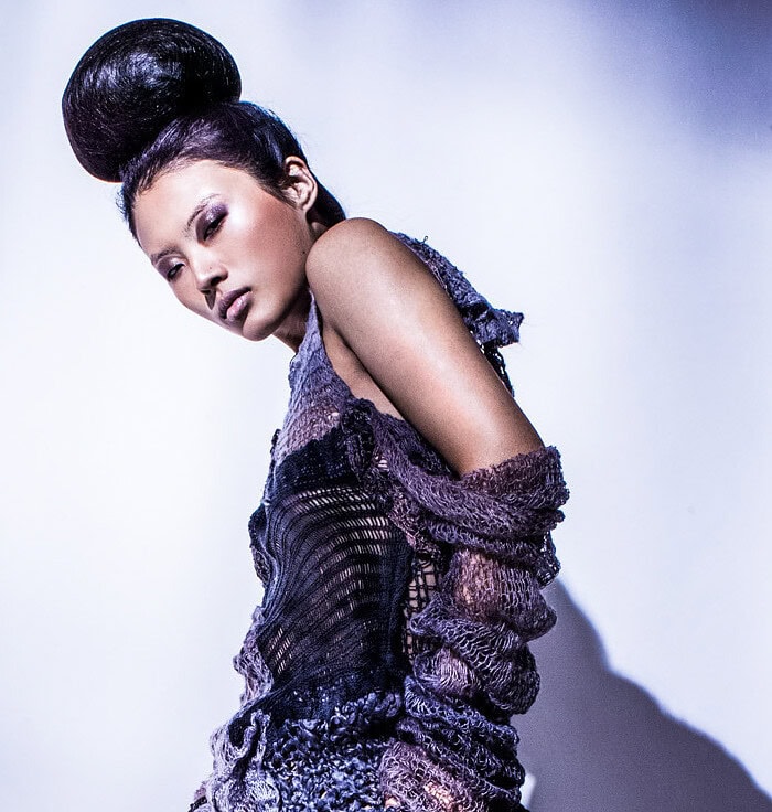 Three-panel fashion layout featuring white and dark blue sculptural knitwear looks.
