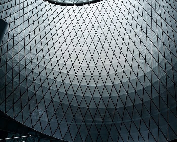 Dark geometric glass dome inside Fulton Center during the COVID slowdown in Lower Manhattan.