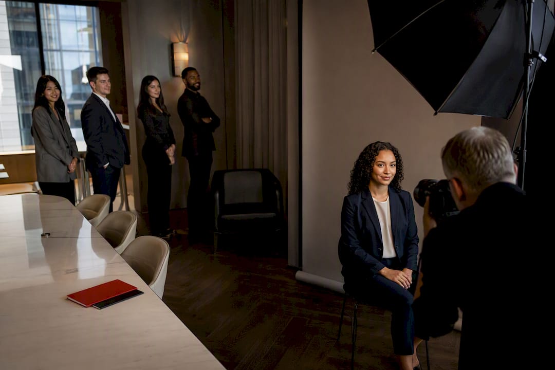 Photographer running a company headshot day