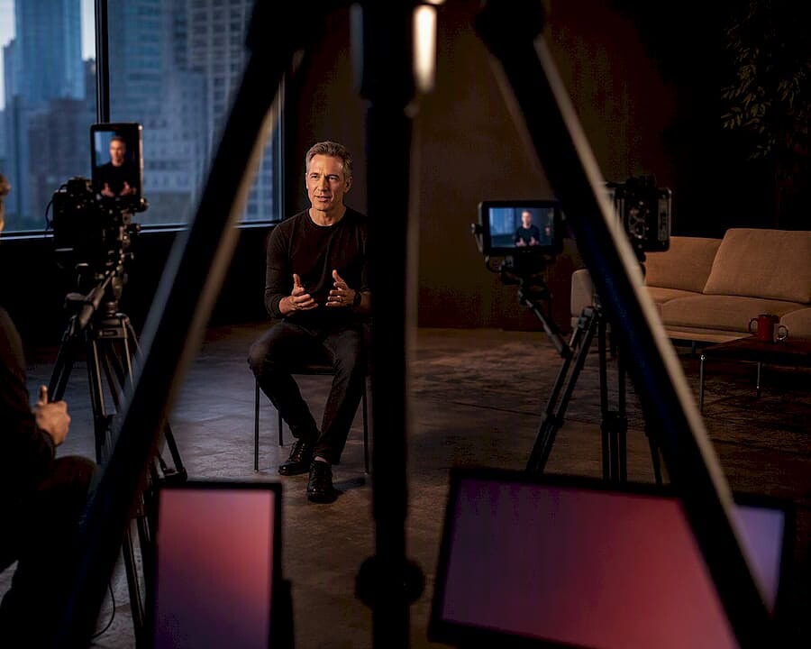 Videographer capturing vertical and horizontal interview formats