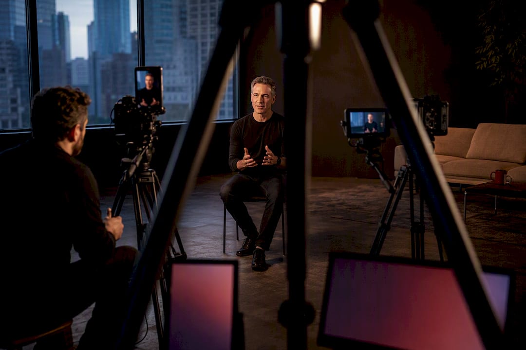 Videographer capturing vertical and horizontal interview formats