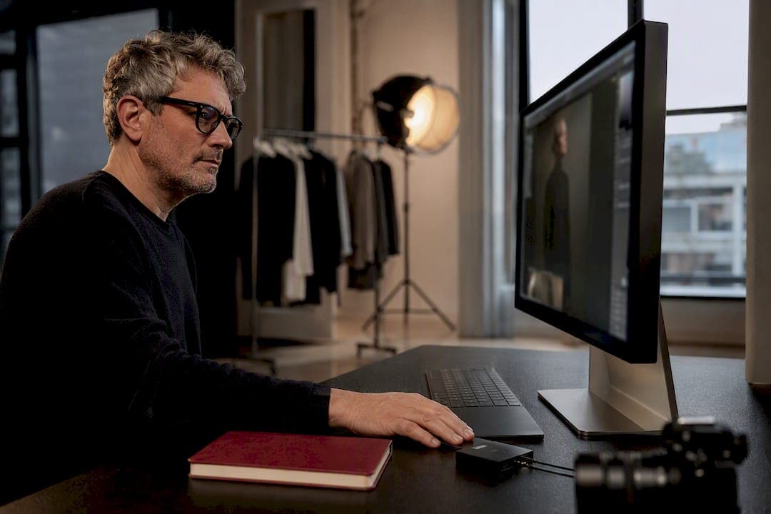 Photographer reviewing press-ready portrait file