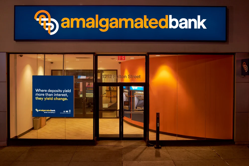 Amalgamated Bank Fulton Street branch exterior photographed at night in New York City