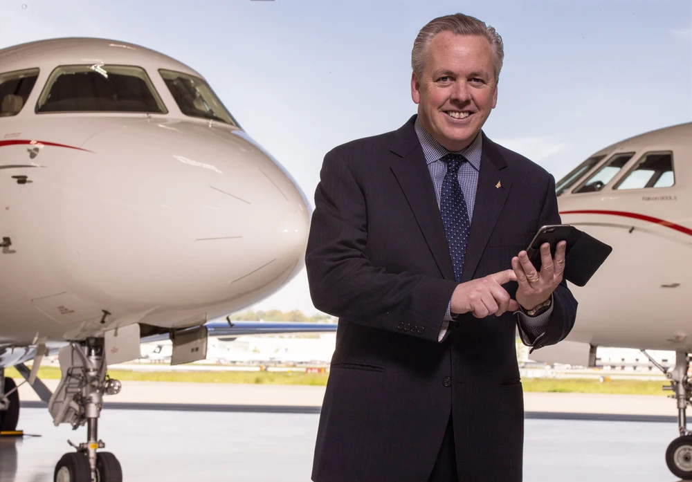 Dassault Falcon Jet executive portrait photographed with private aircraft in a hangar