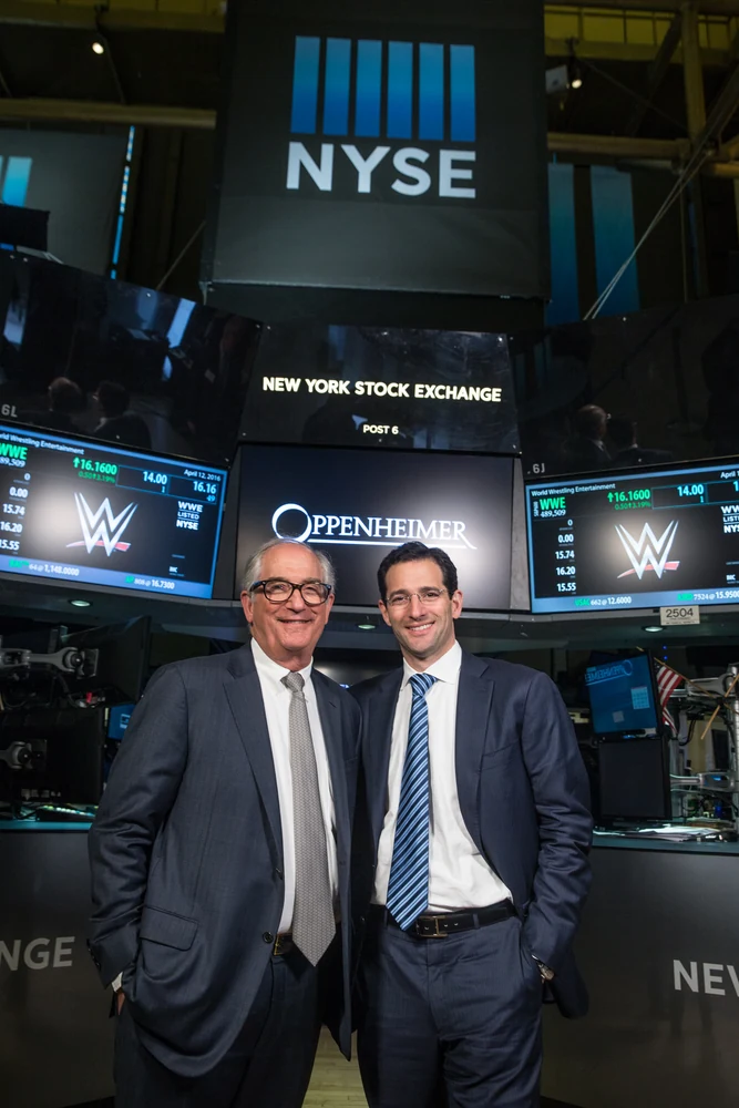 Two Oppenheimer executives photographed at the New York Stock Exchange
