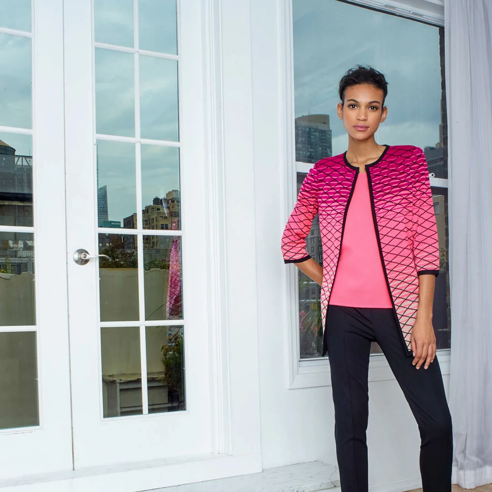 Ming Wang model in a pink jacket photographed on a New York rooftop