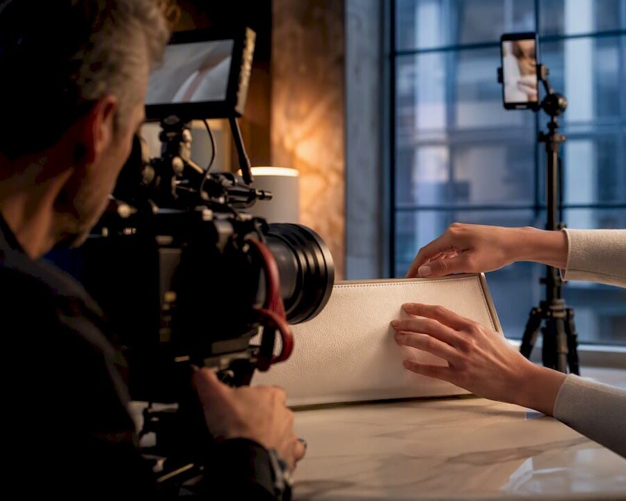 Cinematographer filming a product demonstration