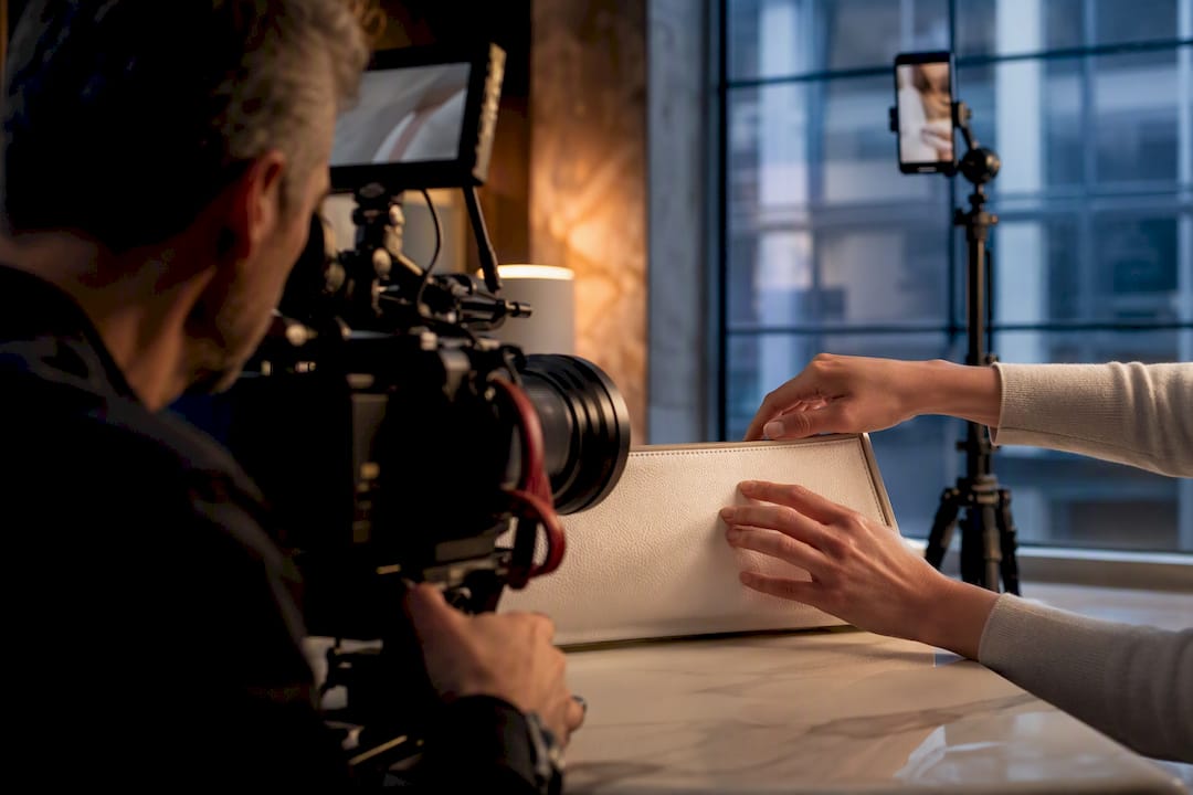 Cinematographer filming a product demonstration