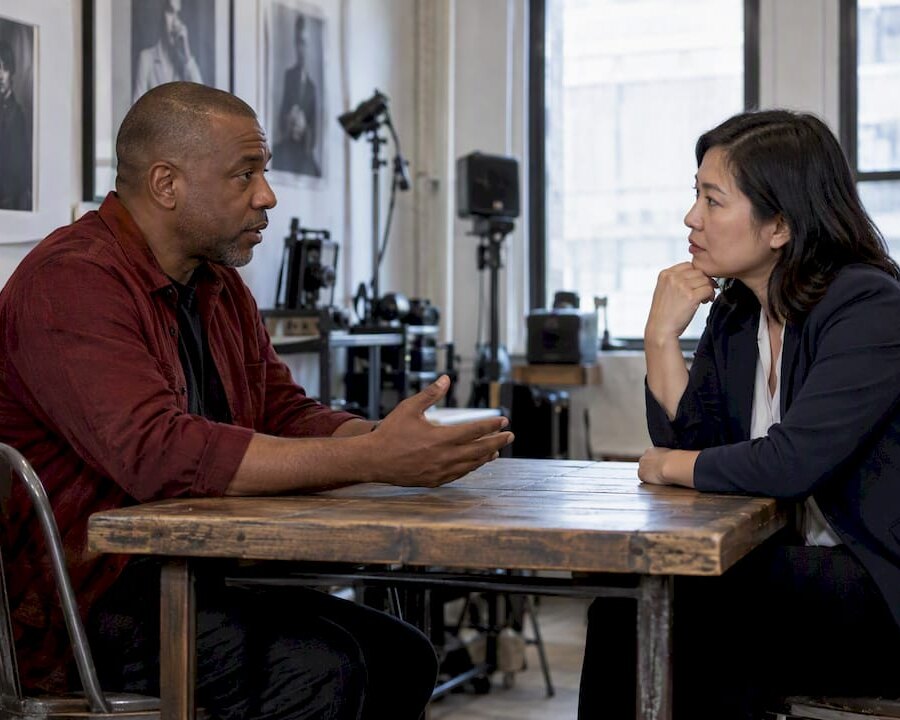Studio manager discussing cancellation notice with client