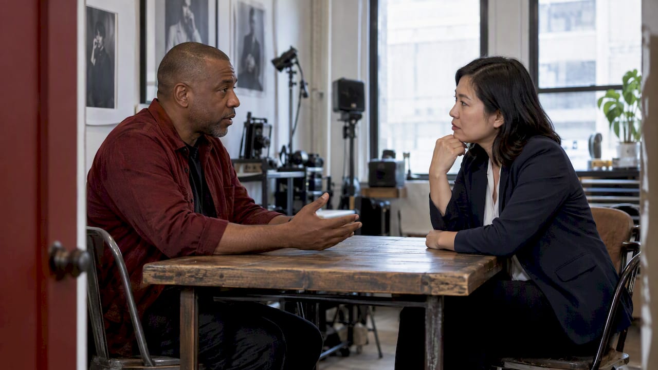 Studio manager discussing cancellation notice with client