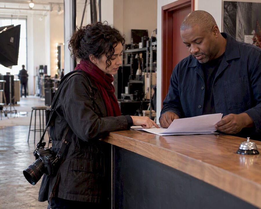 Photographer reviewing studio insurance paperwork