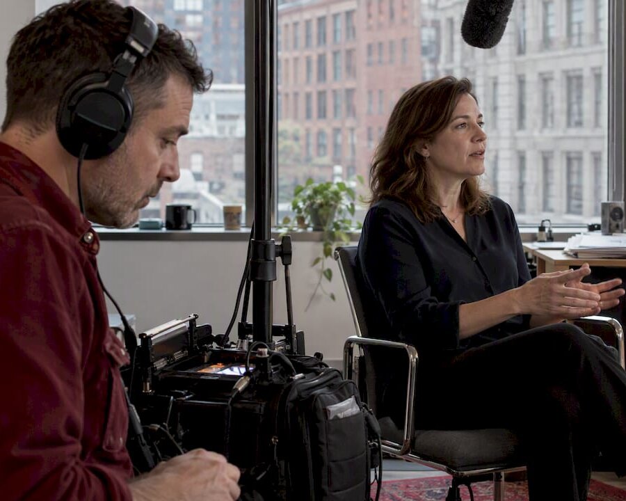 Sound recordist monitoring a live interview