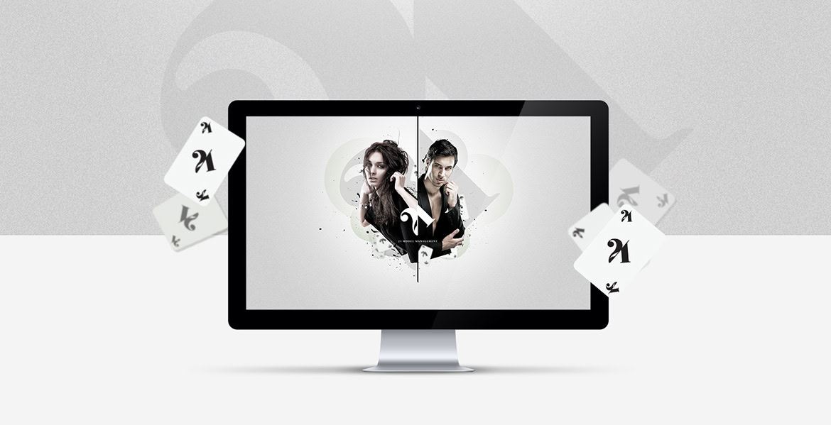 A computer monitor displaying two people with playing cards around it.