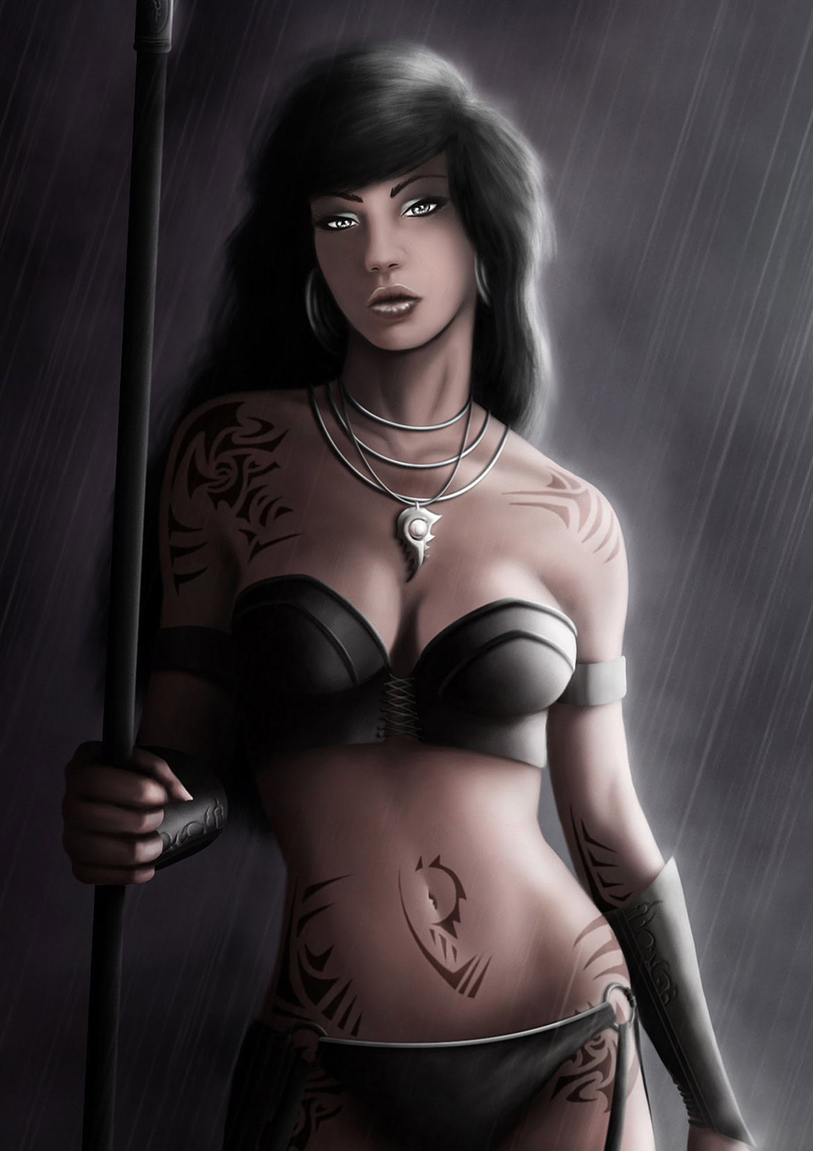 A woman with black hair and tattoos, holding a staff in the rain, wearing a black strapless top and jewellery.