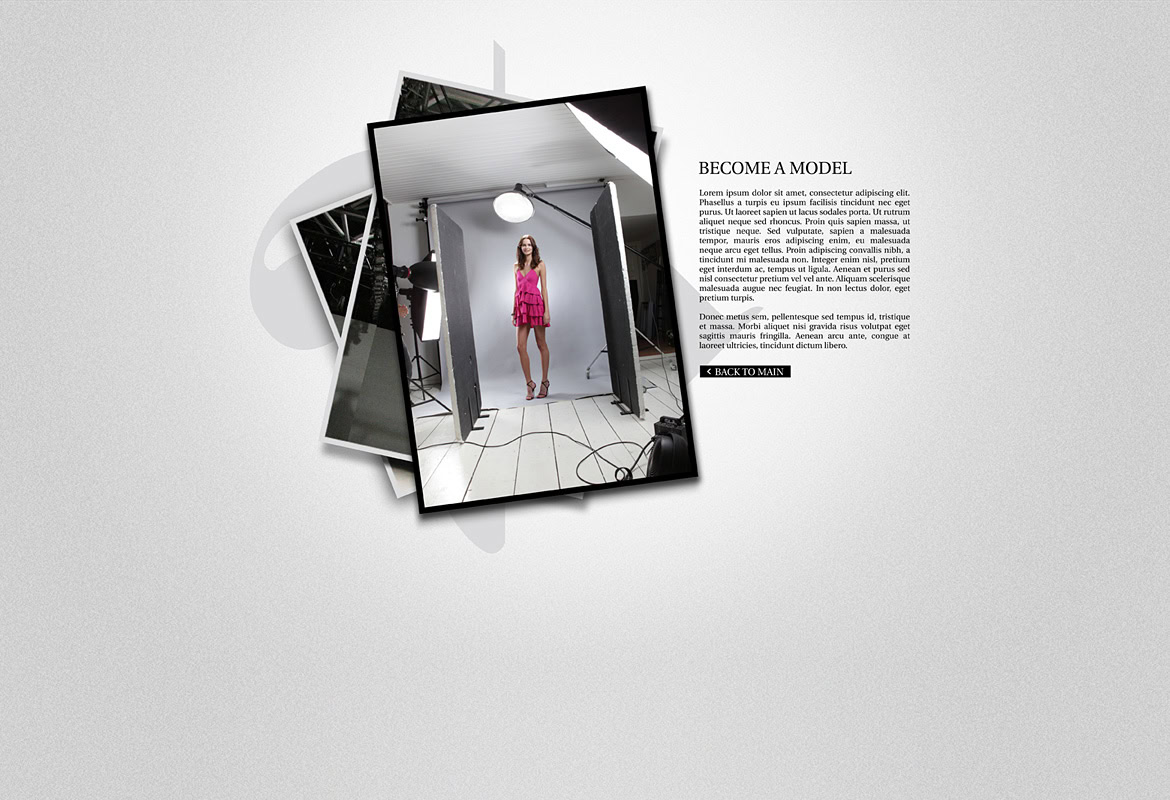 A woman standing in a photography studio with lighting equipment and a backdrop.
