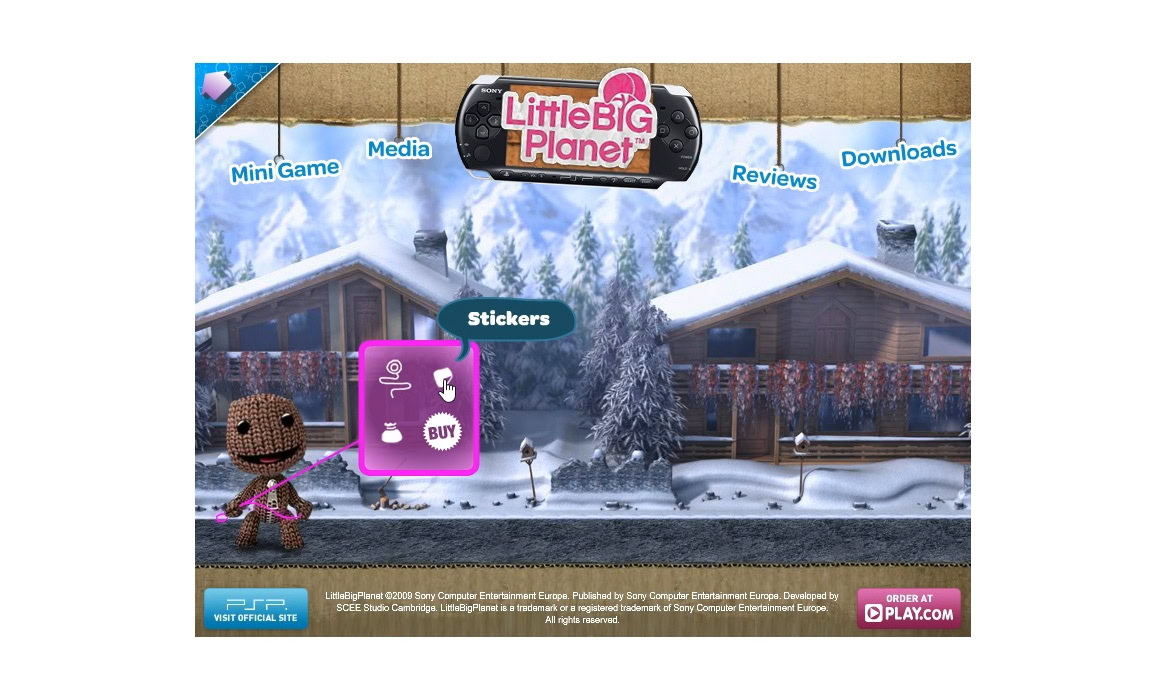 LittleBIG Planet game menu screen showing options for Mini Game, Media, Reviews, Downloads, and Stickers, with a snowy background and a character holding a purple sticker.