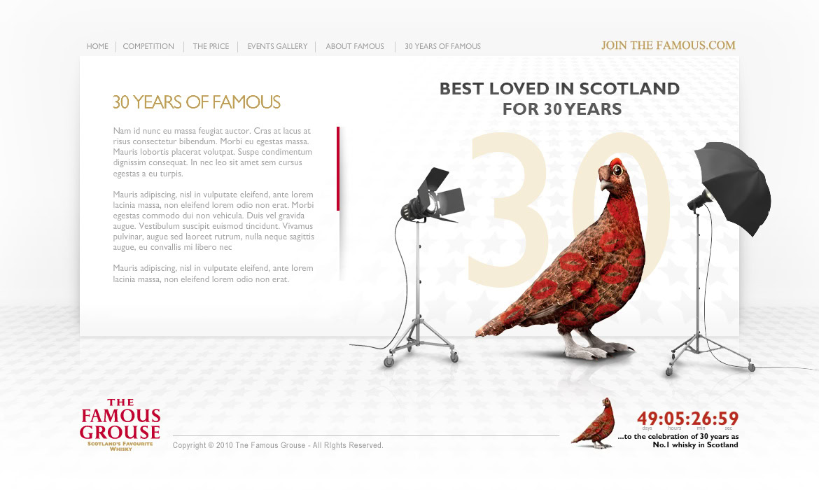 A large grouse with a smaller grouse nearby, set in a photography studio with lighting equipment.
