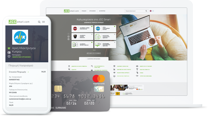 A person using a laptop with a JCC Smart website displayed on a tablet and a credit card in the foreground.