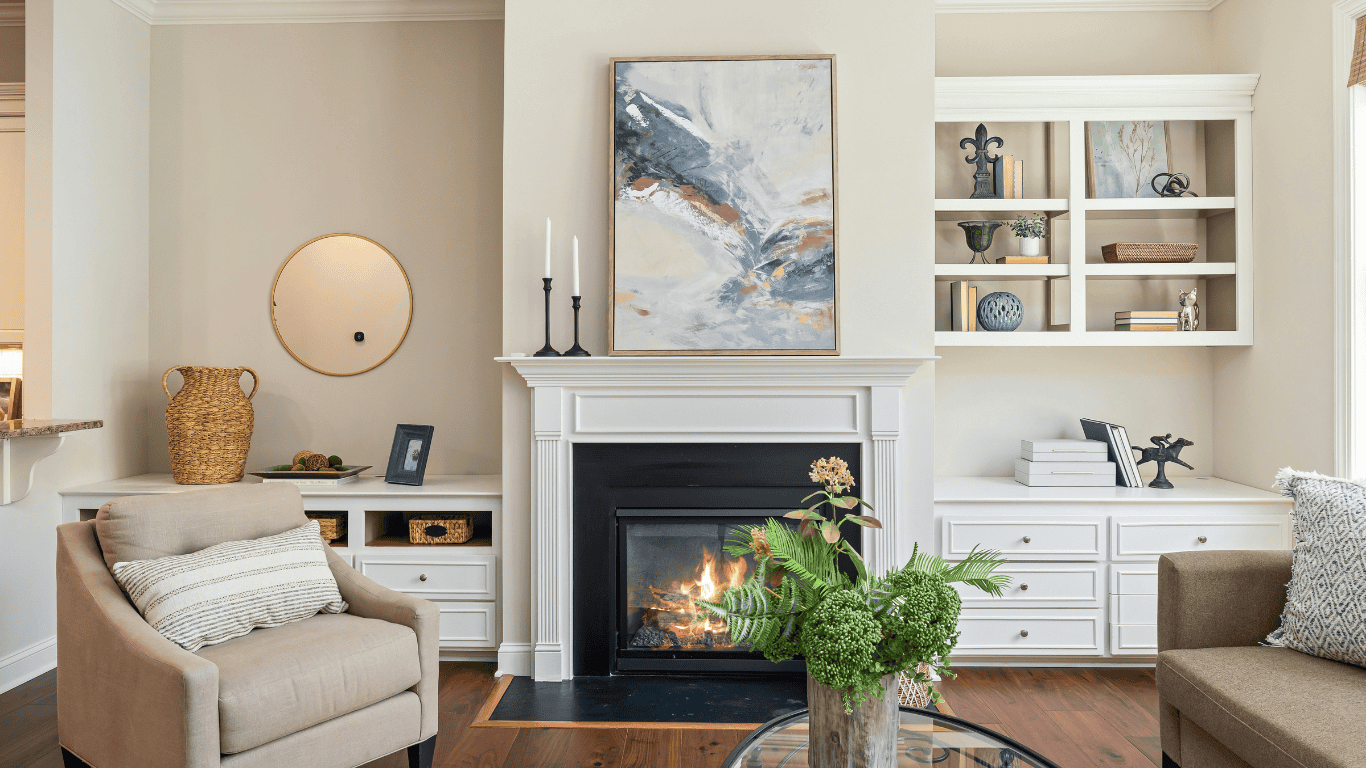 Cozy living room featuring a fireplace, artwork, and stylish decor elements.