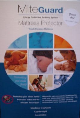 Mite-Guard mattress protector fully enclosing a bed with dust mite barrier cover