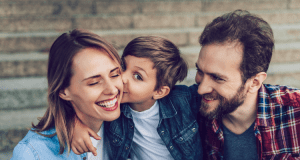 Happy family sharing a loving moment together, reflecting the importance of a healthy home environment.