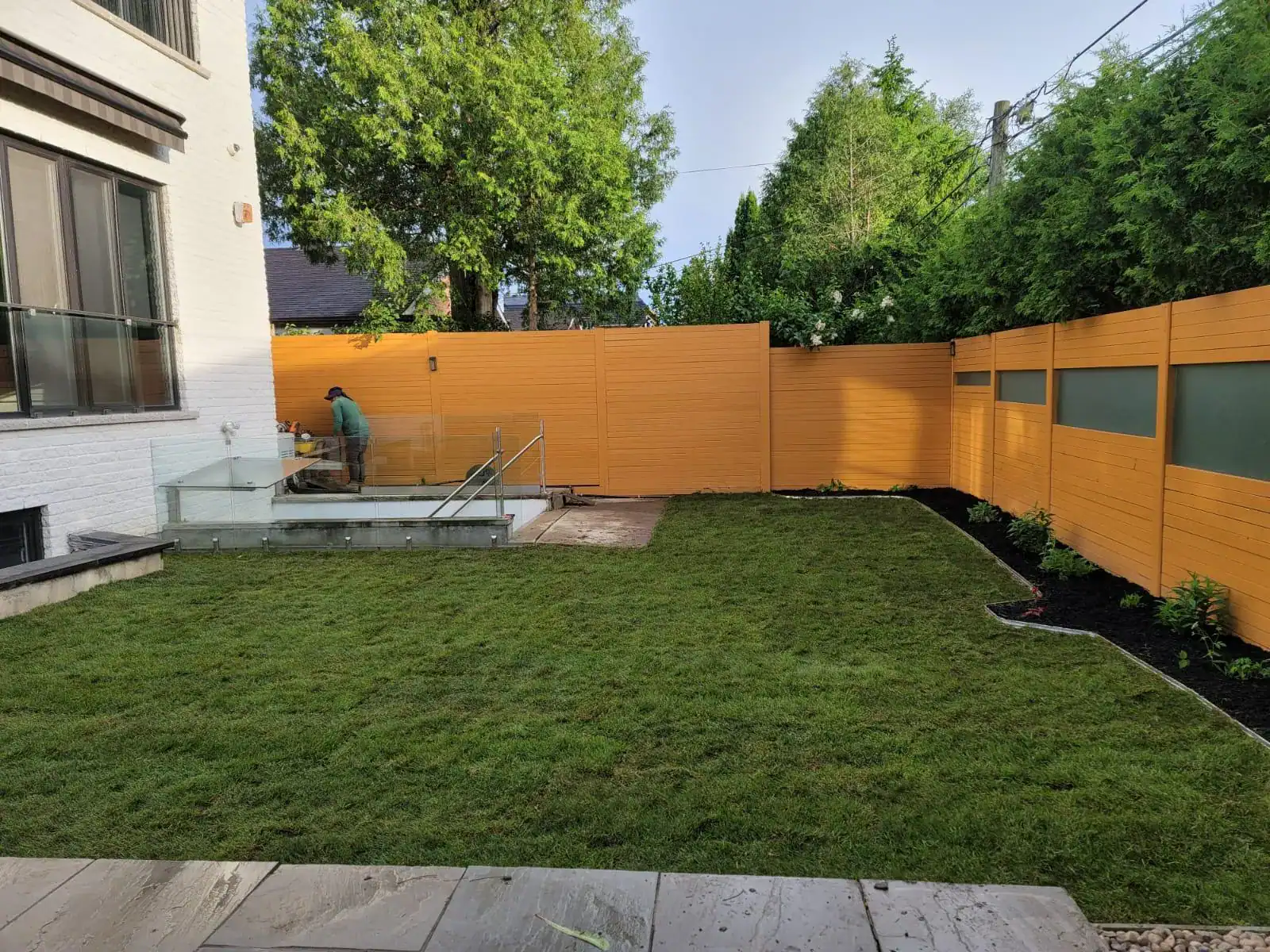 Lawn care expert consulting with homeowner on lawn maintenance strategies
