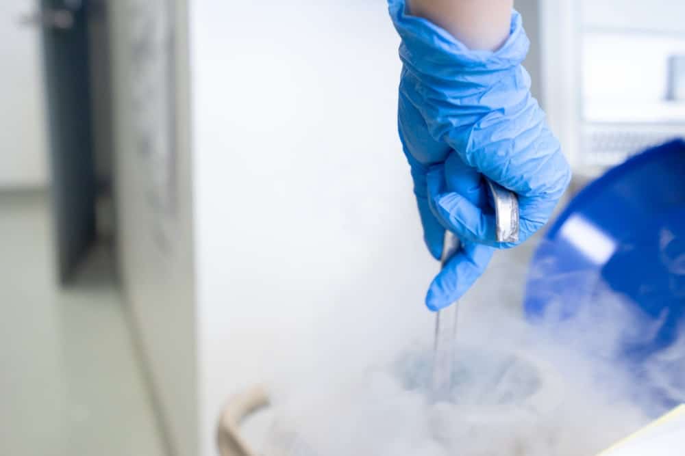 Fertility lab technician handling egg freezing process at Nandi IVF.