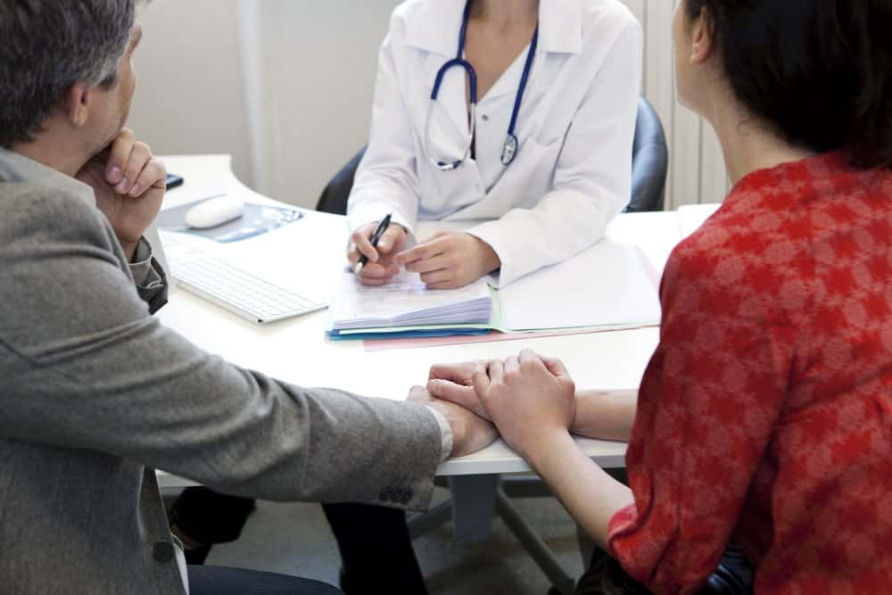 Doctor consulting with a couple about fertility options at Nandi IVF clinic.