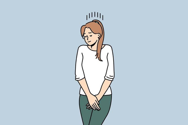 Woman experiencing discomfort after embryo transfer in IVF treatment.