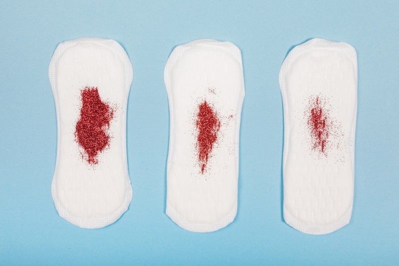 Blood-stained sanitary pads indicating early pregnancy symptoms.