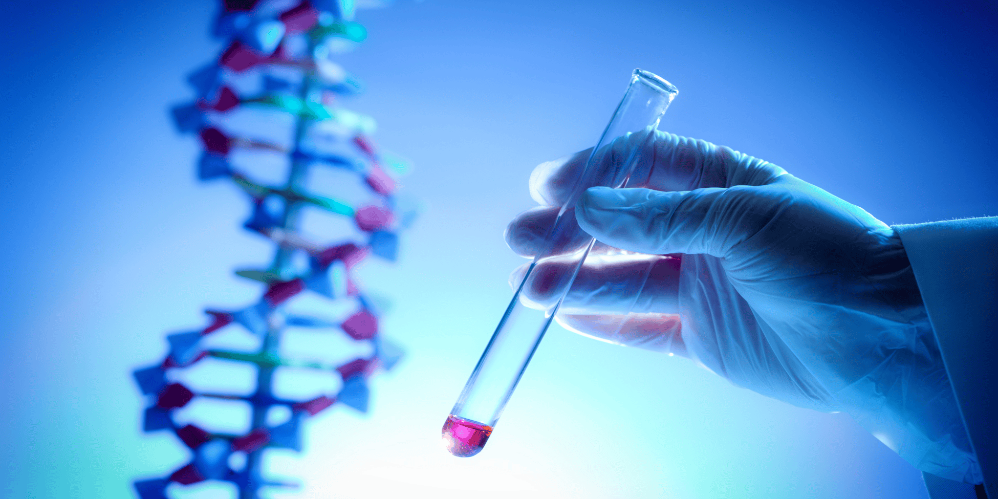 Scientist holding a test tube with DNA strand in background.