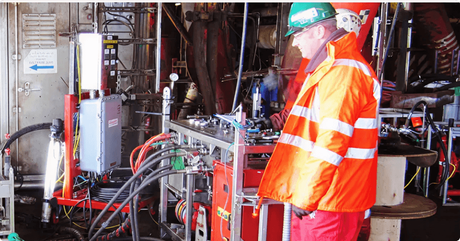 Offshore engineer conducting well intervention operations