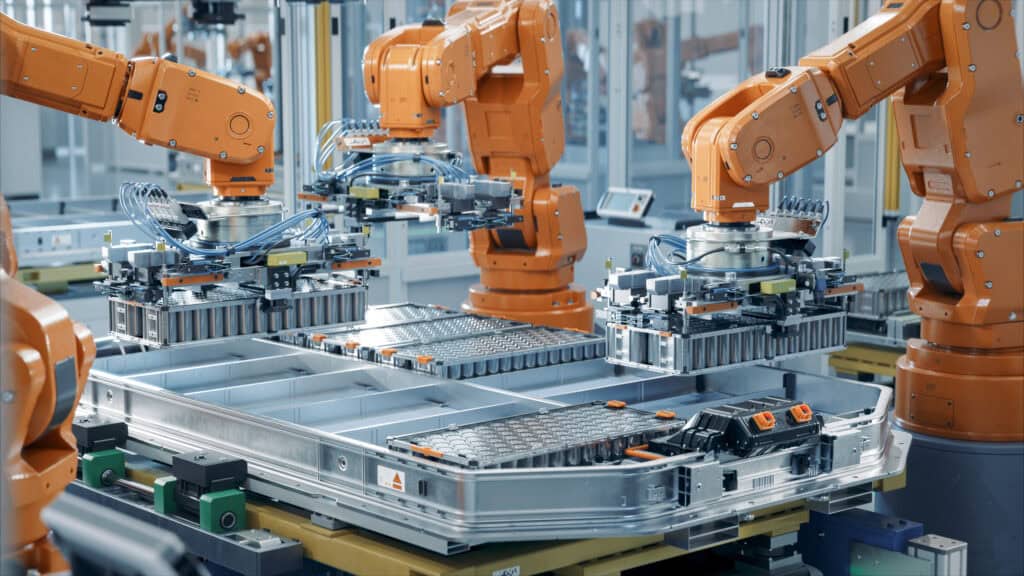 Automated assembly line manufacturing lithium-ion battery cells in a cleanroom environment.