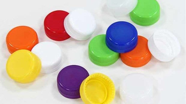 Colourful plastic bottle caps in red, blue, green, yellow, purple, orange, and white – versatile and eco-friendly recycling accessories.