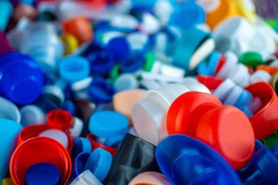 Recycling plastic bottle caps for environmental sustainability and waste reduction in waste management processes.