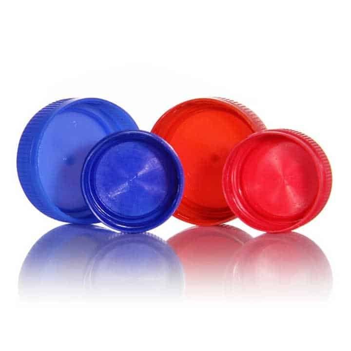 Colourful plastic bottle caps in blue and red, close-up on white background, eco-friendly packaging, recyclable materials, sustainable product design.