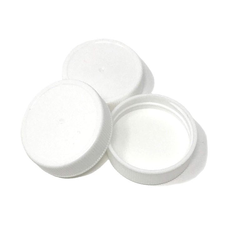 White plastic bottle caps for packaging and branding purposes.