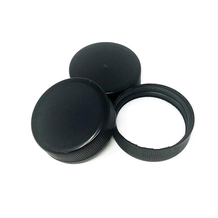 Black hockey puck and goalie mask circle cover, used for ice hockey equipment protection and gameplay. Essential accessories for ice hockey players to ensure safety on the ice.