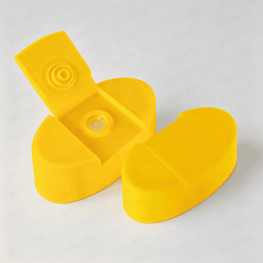 Bright yellow flip top cap designed for bottles, featuring a secure hinge and easy-open mechanism, ideal for packaging liquids and pharmaceuticals.