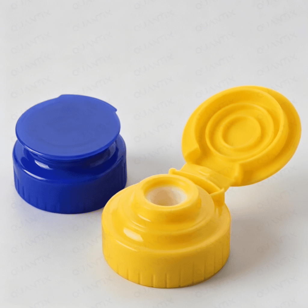 Close-up of yellow and blue silicone valve caps, highlighting their flexible design and sealing features for industrial applications.