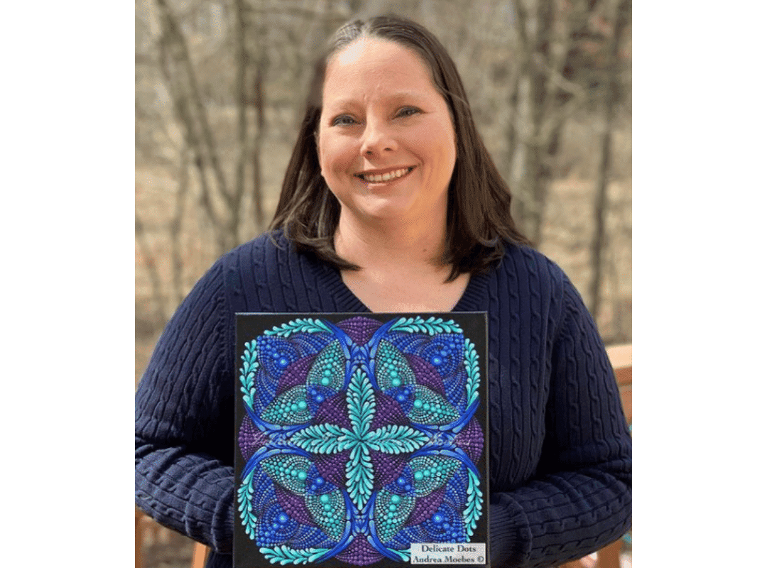 How to Make a Rainbow Inspired Mandala Art Dot Painting 4 andrea holding a blue teal and purple mandala dot painting